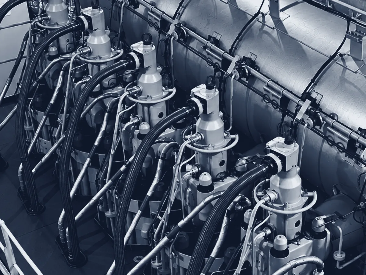 Cylinder units on top of a large two-stroke main engine in a ship's engine room